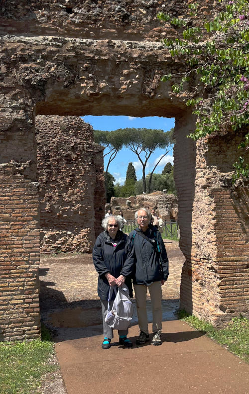 Miriam and Phil standing in an open square archway